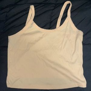 A pastel orange tank top